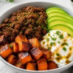Ground beef hot honey bowl with rice, avocado, roasted sweet potatoes and creamy topping