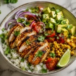 Grilled chicken avocado corn bowl with rice, avocado, grilled chicken and fresh vegetables